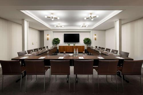 a large conference room with a large table and chairs at Hotel Seville NoMad - The Unbound Collection by Hyatt in New York