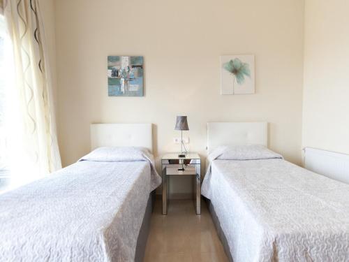 En eller flere senge i et værelse på Holiday Home in Empuriabrava with Private Pool