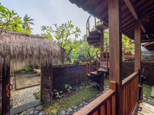 a view from the outside of a house with a thatch roof at Aruna Jayanti Villa in Tejakula