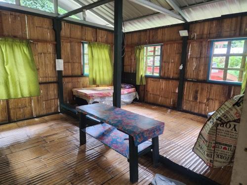 Postel nebo postele na pokoji v ubytování Langanan Campground Poring Ranau