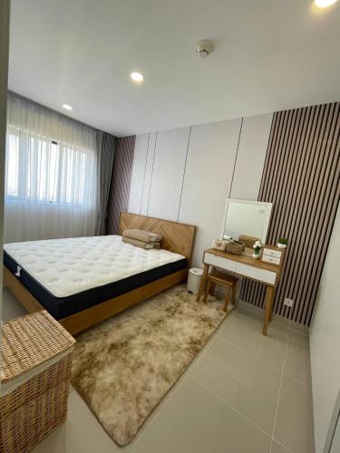 Llit o llits en una habitació de Parkland TK Condo
