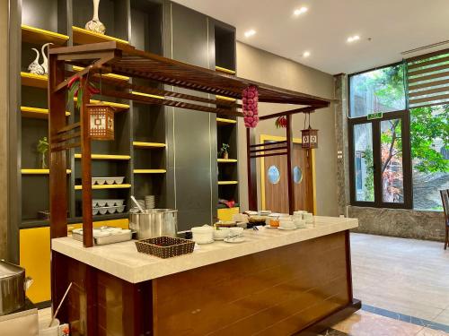 a kitchen with a counter with food on it at Muong Thanh Grand Xa La Hotel in Hanoi