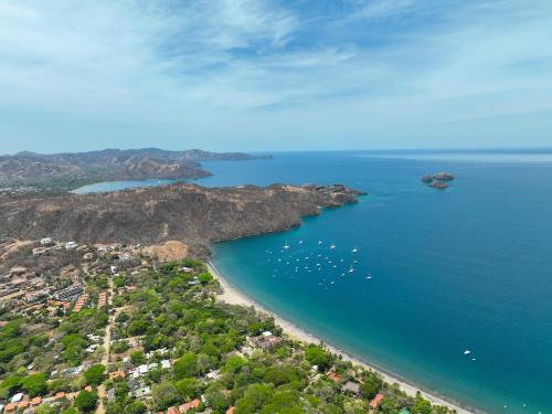 an aerial view of a beach with boats in the water at Cozy home near the beach in Playa Hermosa in Playa Hermosa