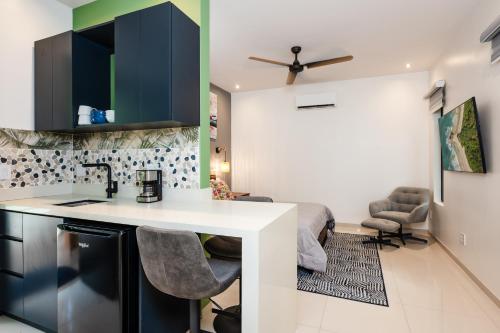a kitchen with a sink and a counter top at 2 Nature Villas with Pool in Santa Cruz
