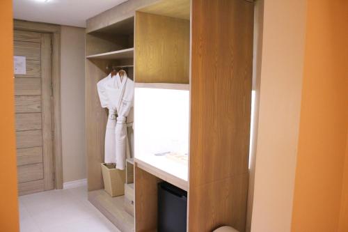 a walk in closet with a counter and a sink at The Muse Hotel Boracay in Boracay