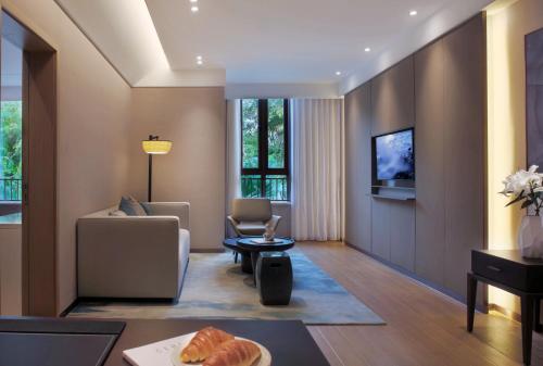 Sanya Han's Grace Hotelにあるテレビまたはエンターテインメントセンター