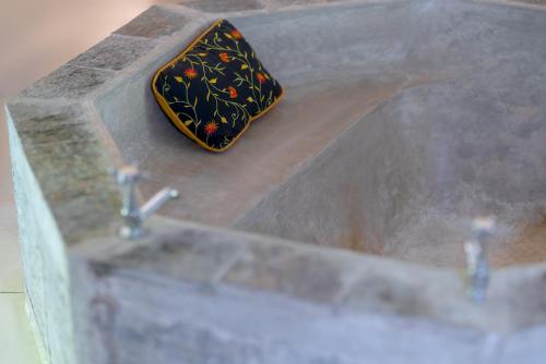 a soap dish sitting on top of a sink at Adigars Manor in Kandy