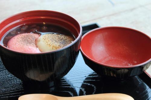 two cups of coffee sitting on top of a table at Tabist Hotel Yakumo Matsue in Matsue