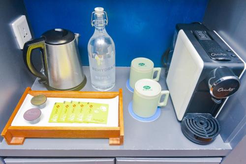 a table with a bottle of water and a chess at Sojourn Spa Hotel Melaka in Melaka