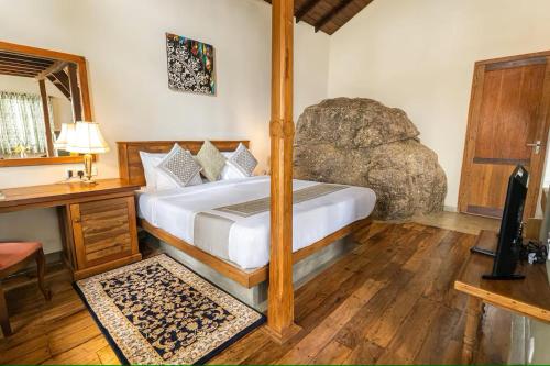 a bedroom with a bed and a desk in a room at New Villa - Nugaliyadda in Kandy