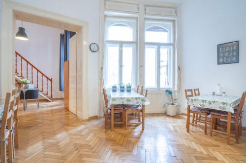 a dining room with a table and chairs at Cedar Inn Budapest - Palace District in Budapest