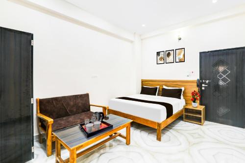 Postel nebo postele na pokoji v ubytování Super Collection O Karaudi Marg Chittaipur Varanasi