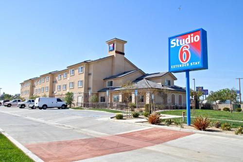 a sign for a hotel in front of a building at Studio 6-Bakersfield, CA in Bakersfield
