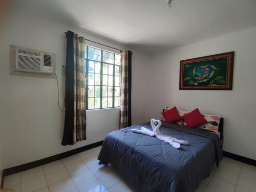 Postel nebo postele na pokoji v ubytování Antonio Homestay