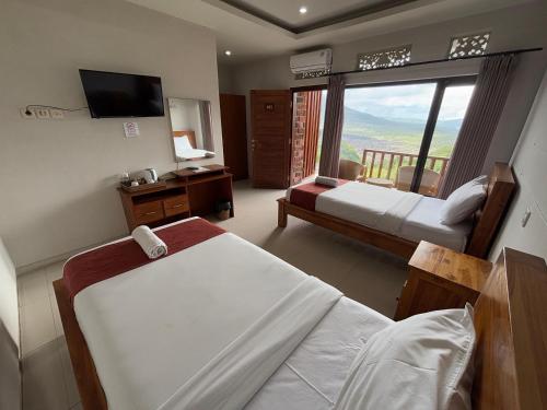 Postel nebo postele na pokoji v ubytování Caldera Hotel & Restaurant