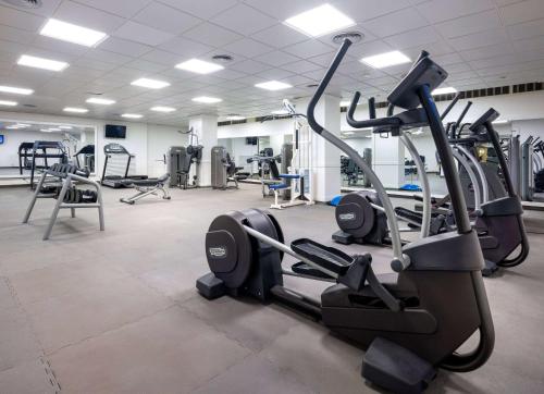 a gym with several treadmills and cardio machines at Sol Falco Menorca in Son Xoriguer