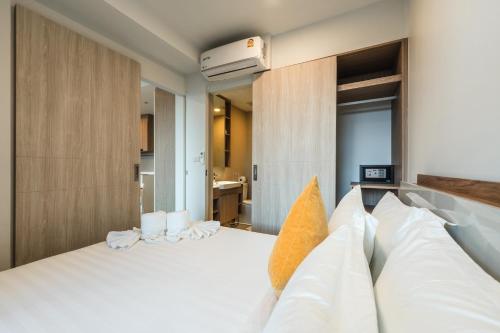 Ένα ή περισσότερα κρεβάτια σε δωμάτιο στο Laguna Skypark Residences