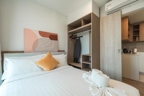 Ένα ή περισσότερα κρεβάτια σε δωμάτιο στο Laguna Skypark Residences