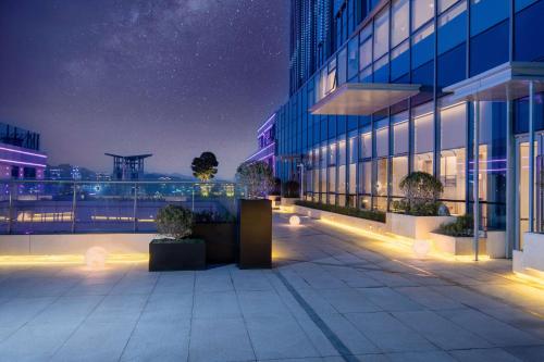 a night view of a building at night at Doubletree By Hilton Guang'An in Guang'an