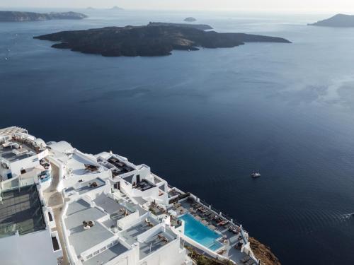 an aerial view of the ocean and white buildings at Belvedere Suites in Firostefani