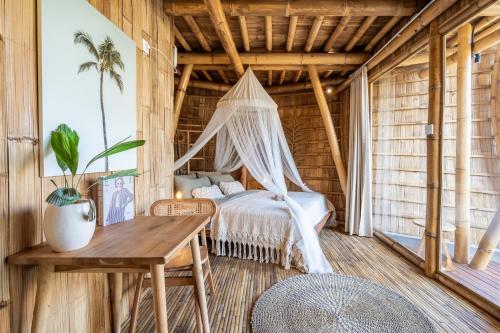 Ένα ή περισσότερα κρεβάτια σε δωμάτιο στο Noon Bamboo Villas