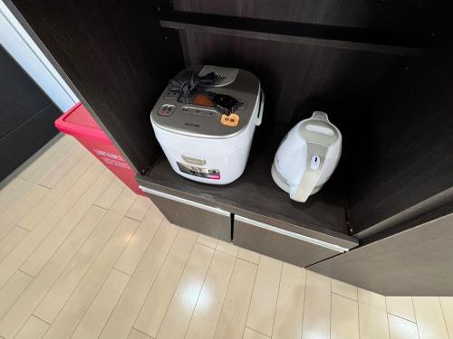 a sewing machine and a appliance in a drawer at 白浜温泉付き貸別荘b-72 in Shirahama