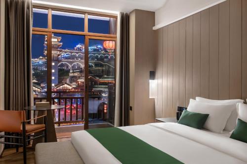 Katil atau katil-katil dalam bilik di Yinmo Hotel