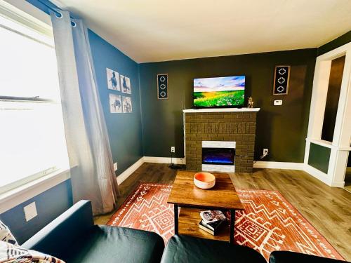 a living room with a couch and a fireplace at 1 Bed1 Bath Condo Wkitchenlr-sleeps Up To 4pp in Russell