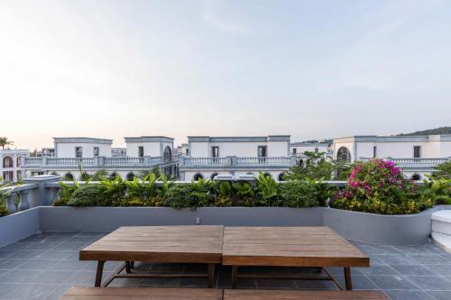 a wooden table on the roof of a building at Family Villa - Phu Quoc Island in Phu Quoc