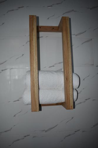 a stack of toilet paper hanging on a wall at Kili Kivuli in Msaranga