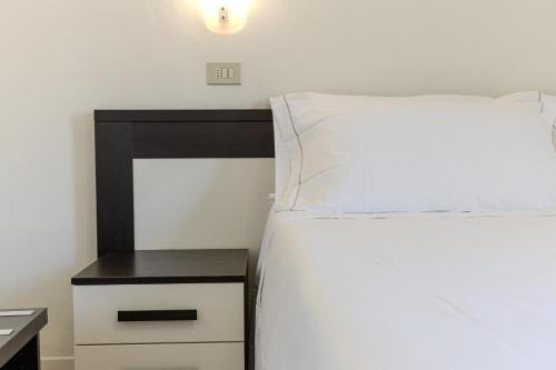 Katil atau katil-katil dalam bilik di Hotel Alla Torre