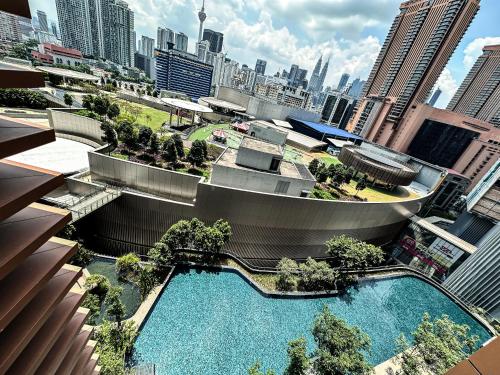 an overhead view of a building with a swimming pool at Lucentia Residence by EAS Maju property in Kuala Lumpur