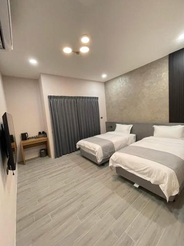 Una cama o camas en una habitación de Fall in love Karuizawa Hostel