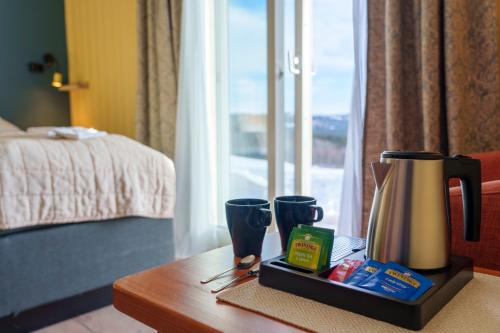 a coffee maker on a table in a hotel room at Grønolen Fjellgard in Beitostøl
