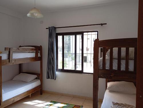 Postel nebo postele na pokoji v ubytování Rose Hostel