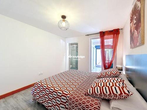 Cama ou camas em um quarto em Escale Ton Jo - 70m - proche du centre-ville de Cilaos