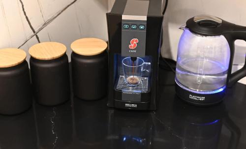 a blender and other items on a table at Studio Hagalil in Tiberias