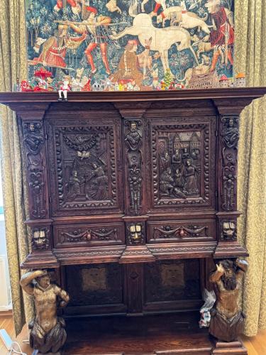 a large wooden cabinet with a painting on the top at House-Museum #Medieval unique experience in Tallinn