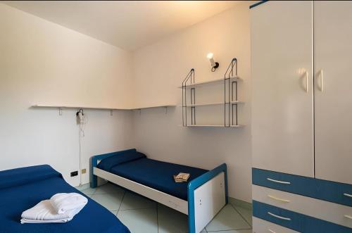 Ένα ή περισσότερα κρεβάτια σε δωμάτιο στο Villa Viola e Giulio