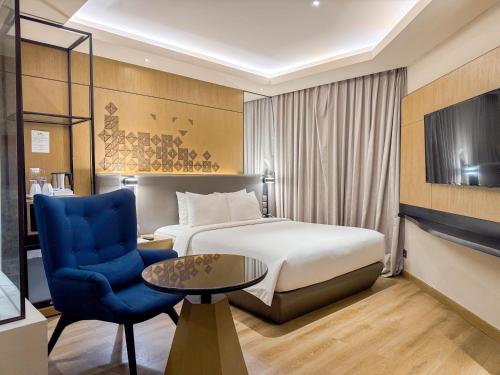 Mercure Jakarta Bataviaにあるベッド