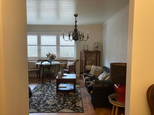 a living room with a couch and a table at Haude Stay in Uuemõisa