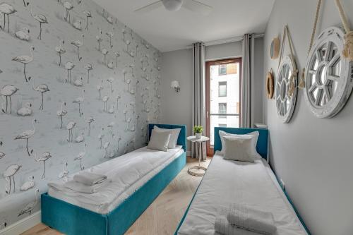 Ένα ή περισσότερα κρεβάτια σε δωμάτιο στο Staywin Riverfront Lofts