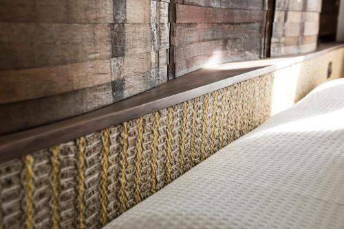 a close up of a bed in a bedroom at Riofavara Winery in Val di Noto in Ispica