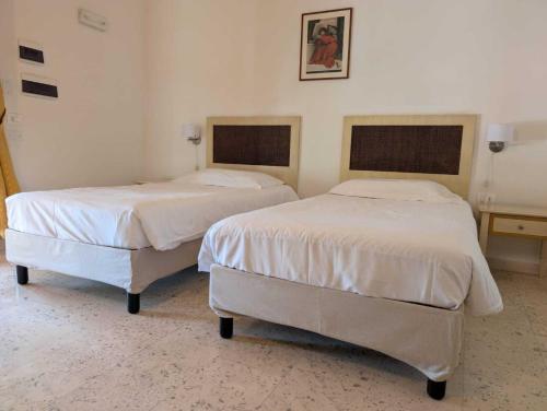Ένα ή περισσότερα κρεβάτια σε δωμάτιο στο La Cipriana