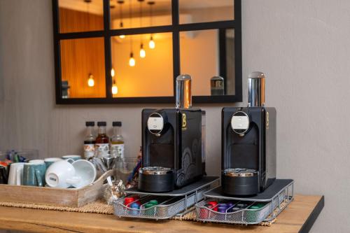 a counter with two coffee makers on top of it at Iso'Bella Vita Guesthouse in Phalaborwa