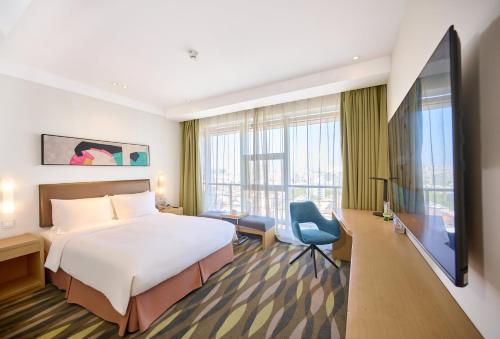 Una cama o camas en una habitación de Holiday Inn Express Changzhou Lanling by IHG