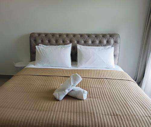 Postel nebo postele na pokoji v ubytování Mslim Friendly Stay at Bayu Aisyah Putrajaya, Presint 11