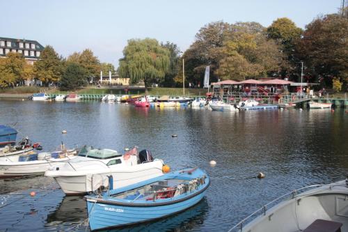 a group of boats are docked in a river at Warnemünde Fischer`s Hus 10139 in Rostock