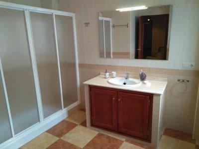 a bathroom with a sink and a mirror at Piso Calle Pelayo in Villanueva de Córdoba