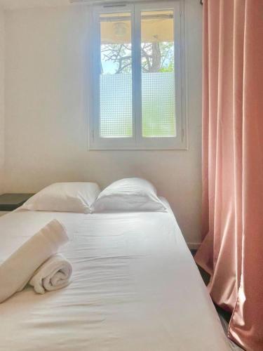 Giường trong phòng chung tại Ajaccio centre ville joli T2 Grandval